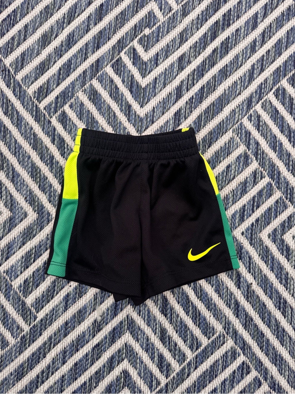 Nike Black Kids Athletic Shorts with Neon Yellow Swoosh and Teal Accents